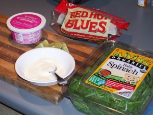 Chiliquiles: creme fraiche, limes, chips, spinach 